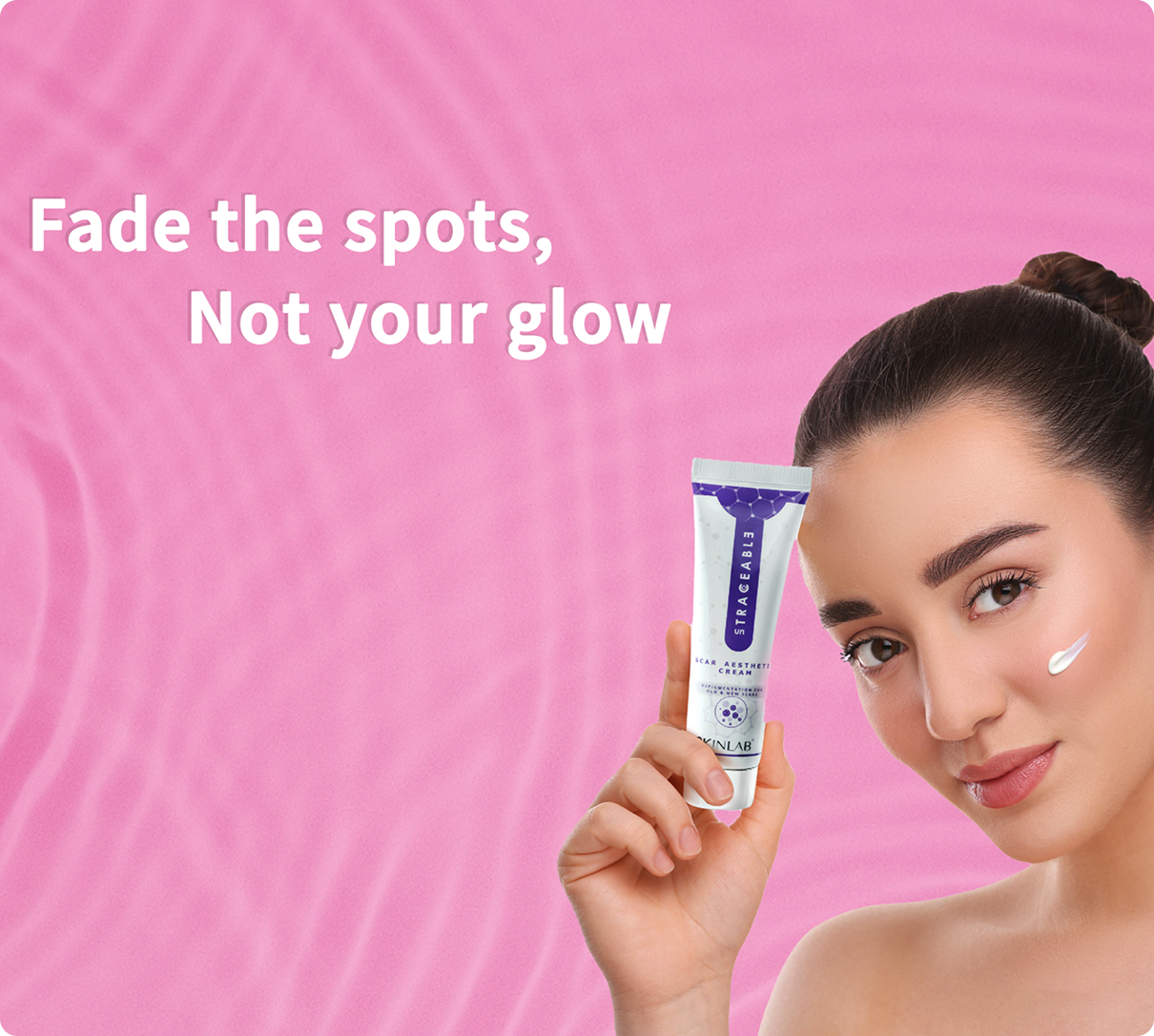 Woman holding a skincare tube with 'Fade the spots, Not your glow' text on a pink background